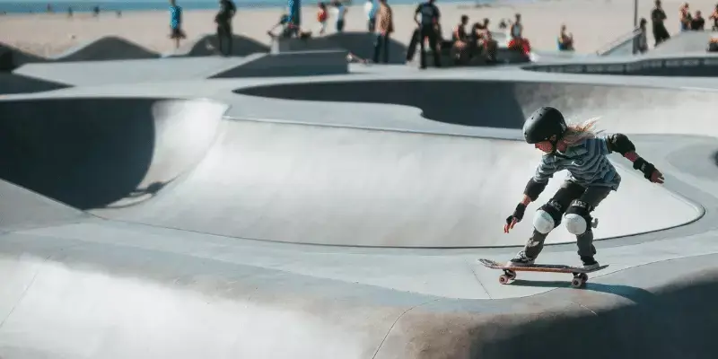 girl skating and wearing a helmet